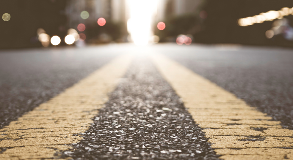 A close up of yellow lines on a city road symbolising the roadmap for a cyber security strategy