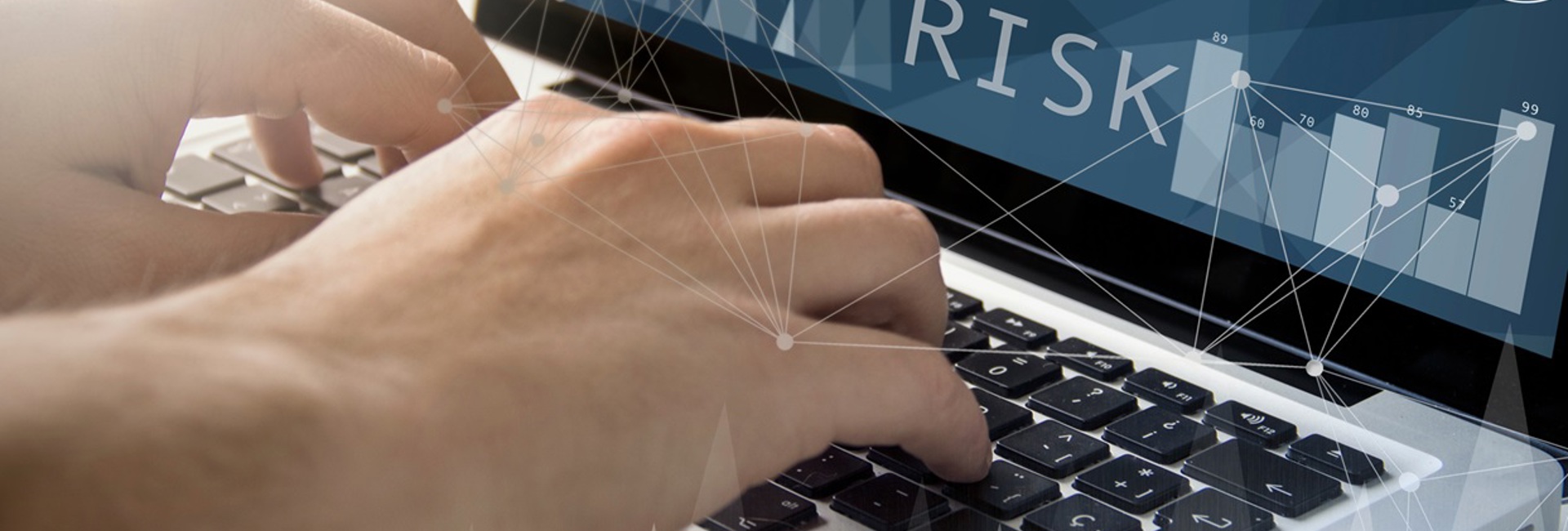 Close up of an Information security managers hands typing on a laptop establishing structured risk management practices