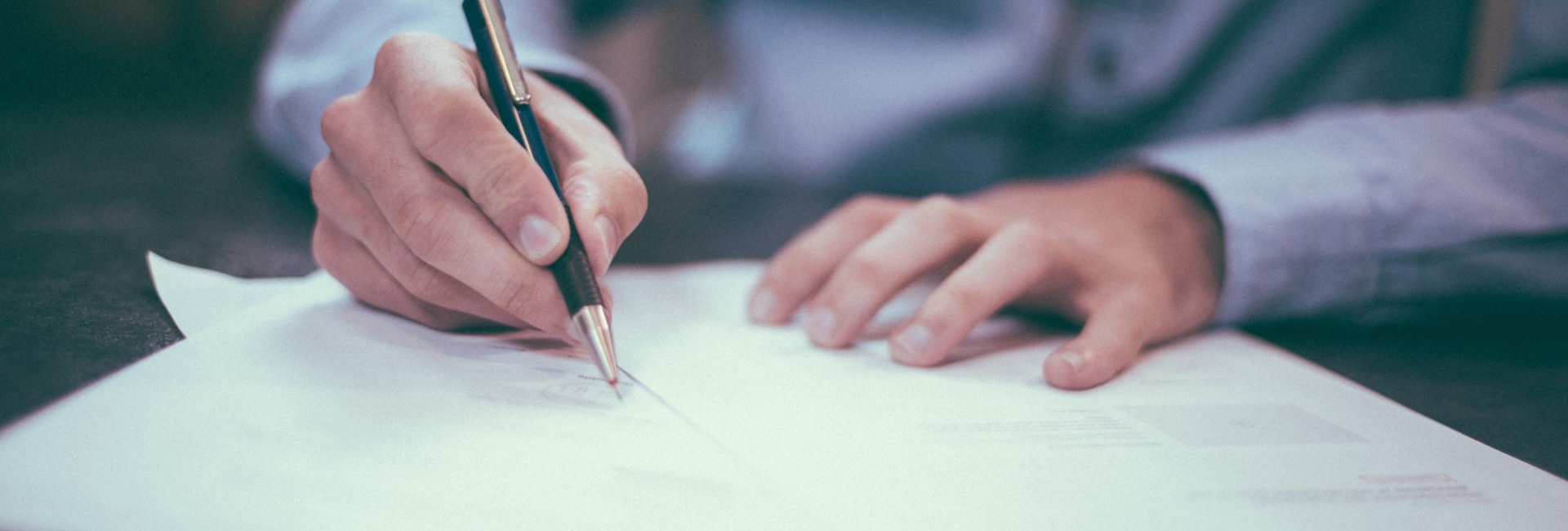 A business man reviewing IT policy paperwork