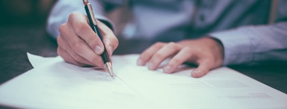 A business man reviewing IT policy paperwork