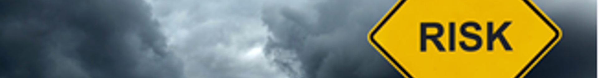 Yellow road sign with the word risk on it