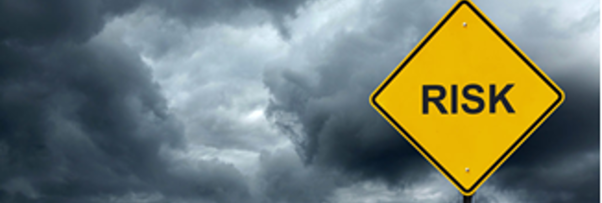 Yellow road sign with the word risk on it