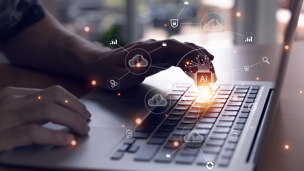 A close up on a businesswoman hands typing on a laptop creating effective AI policies
