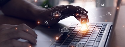 A close up on a businesswoman hands typing on a laptop creating effective AI policies