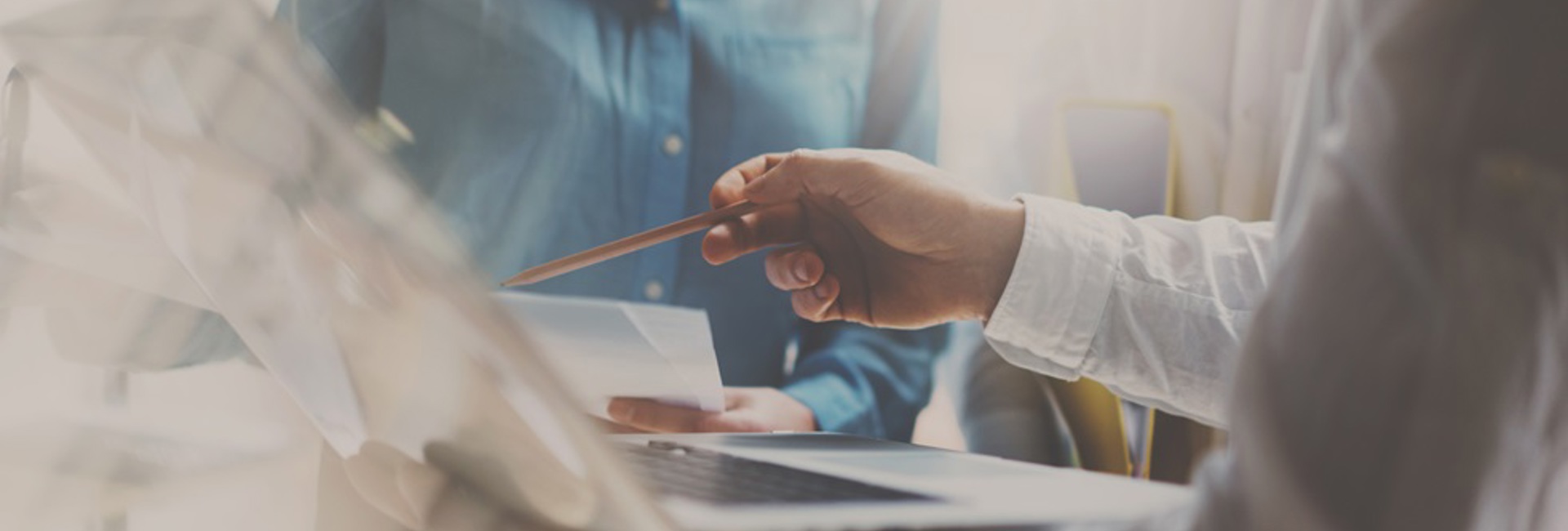 Two IT professionals working on a laptop testing their organisations incident response plan