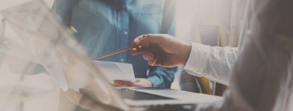 Two IT professionals working on a laptop testing their organisations incident response plan
