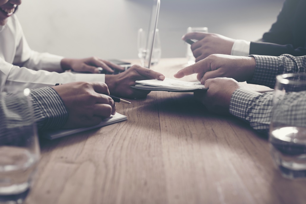 Business people meeting with third part suppliers going through their information security risk management